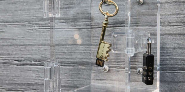 Close up of a key and a padlock